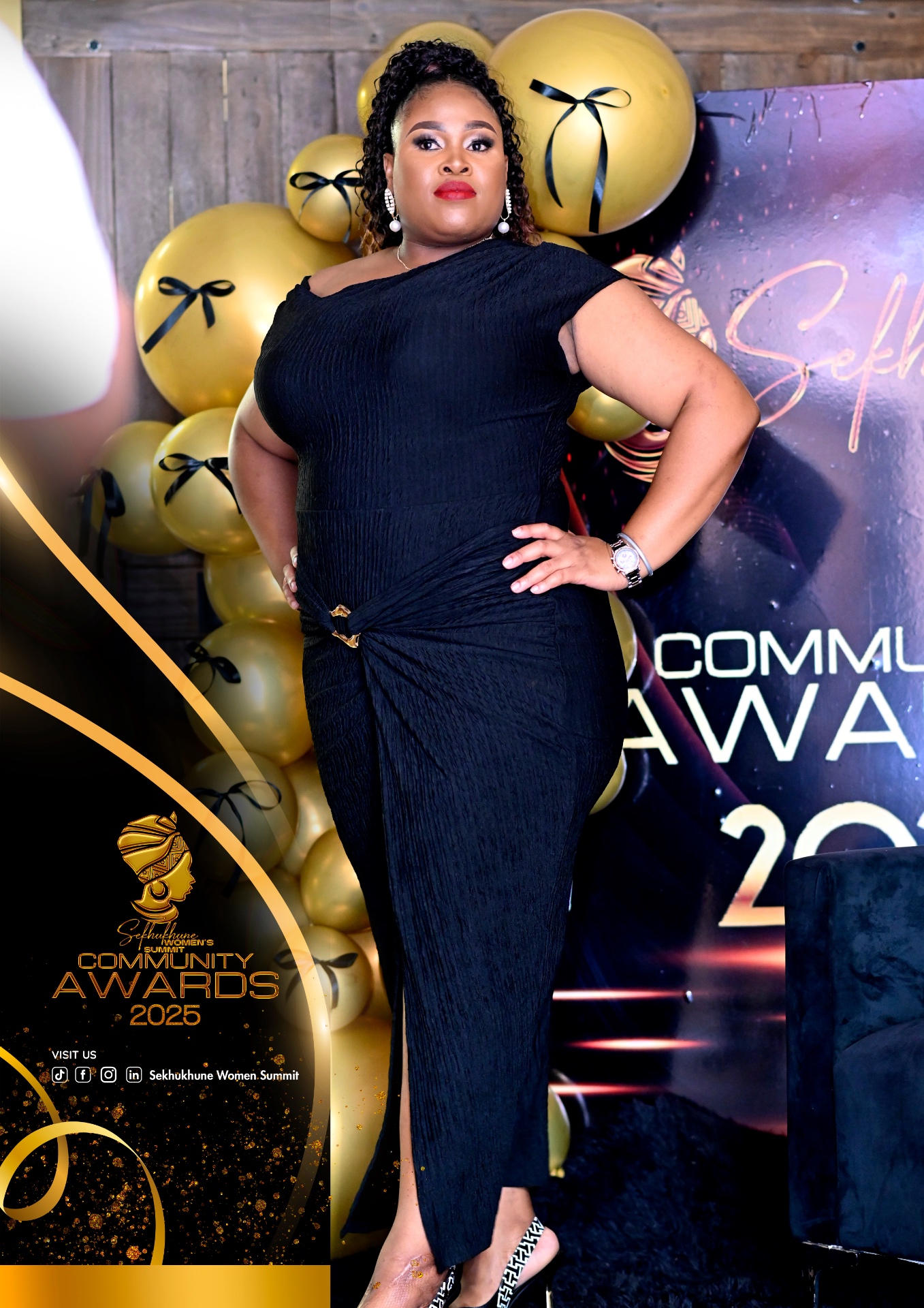 Guest posing in front of gold balloon backdrop